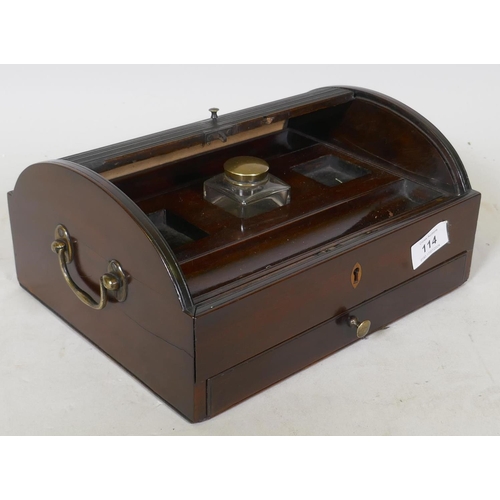 114 - An early C19th mahogany desk stand with dome top tambour, two pen wells and ink bottle over a single... 