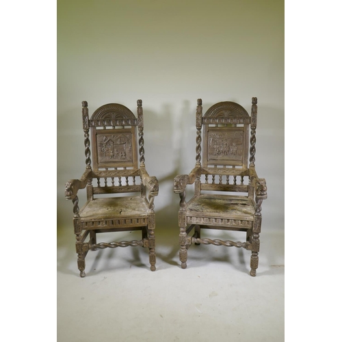 1144 - A pair of antique Continental oak high back hall chairs with carved panel backs and open arms termin... 