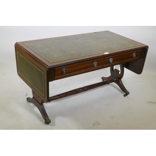 1151 - A mahogany sofa table style drop leaf coffee table, with inset leather top, raised on lyre shaped en... 