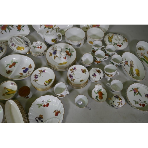 116 - A Royal Worcester Evesham pattern part dinner/tea service and twelve associated Royal Tudor ware pla... 