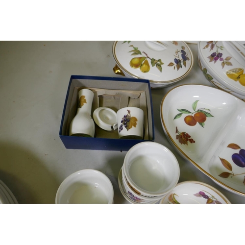 116 - A Royal Worcester Evesham pattern part dinner/tea service and twelve associated Royal Tudor ware pla... 