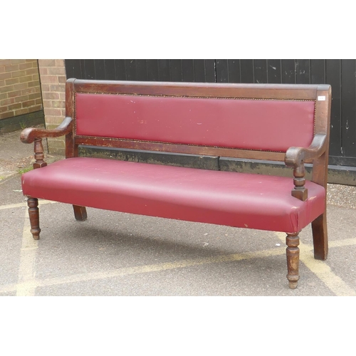 1166 - An antique beechwood bench with leatherette upholstery, 183cm long