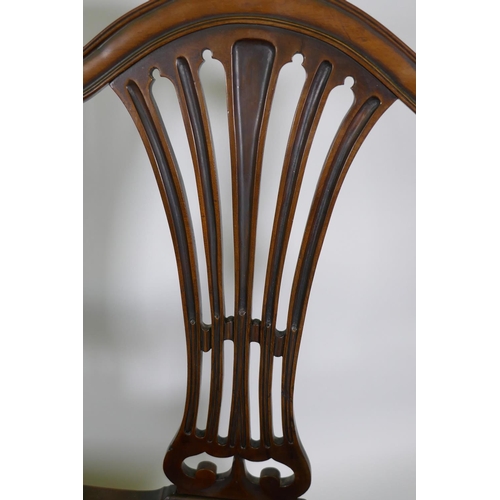 1173 - A pair of C19th Hepplewhite style elbow chairs with pierced splat backs and studded leather seats, r... 