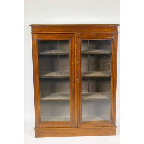 1204 - A Victorian mahogany two door glazed bookcase with adjustable shelves, 80 x 30 x 107cm