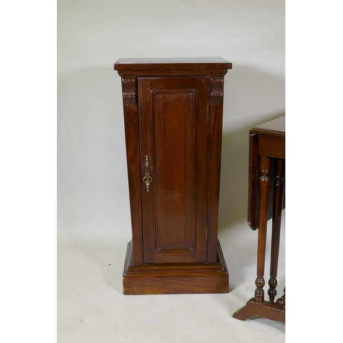 1208 - A Victorian mahogany pedestal cupboard of tapering form, raised on a plinth base, 41 x 33 x 88cm and... 