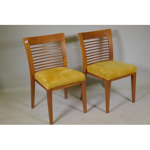 1210 - A set of ten beechwood dining/boardroom chairs with overstuffed seats