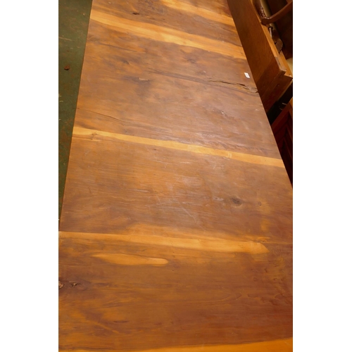 1211 - A bespoke yew wood refectory table with plank top, raised on twisted supports united by an H stretch... 