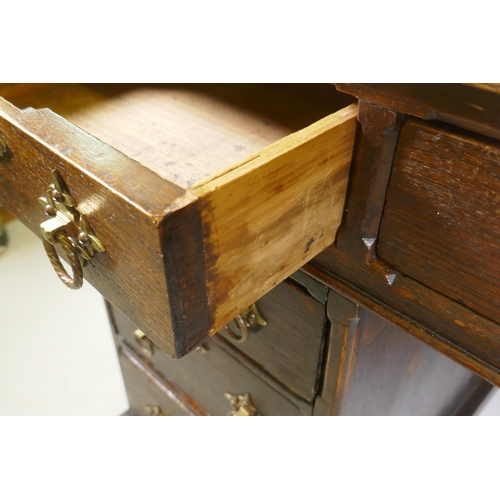 1224 - A Victorian oak on pine pedestal desk, with leather inset top, nine drawers with original brass hand... 