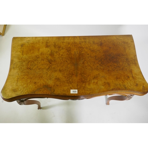 1240 - A Victorian serpentine shaped walnut card table with carved shaped frieze, raised on cabriole suppor... 