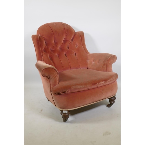 1251 - A Victorian button back nursing chair  raised on turned supports