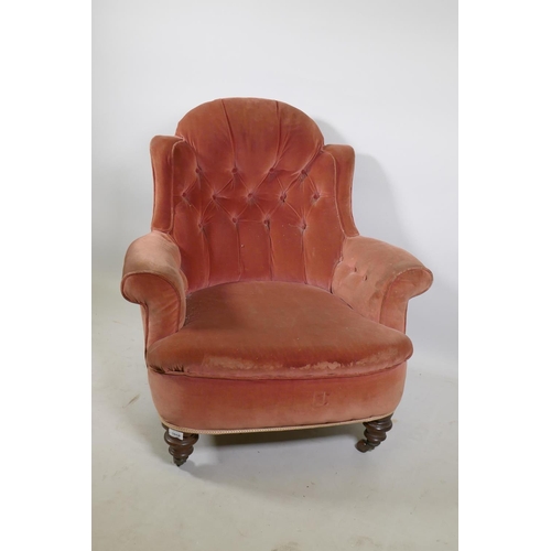 1251 - A Victorian button back nursing chair  raised on turned supports