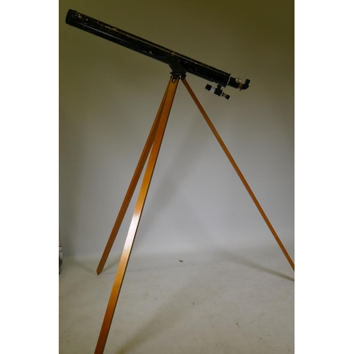 129 - An Irving astronomer's telescope on wood tripod stand, telescope 120cm long, stand 190cm high