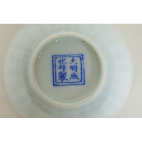 130 - A Chinese Doucai porcelain tea bowl of petal form, decorated with boys playing, 9cm diameter