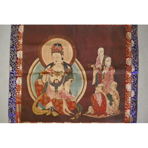 131 - A Tibetan printed thangka depicting Buddha and his followers, in a silk mount, 114 x 110cm