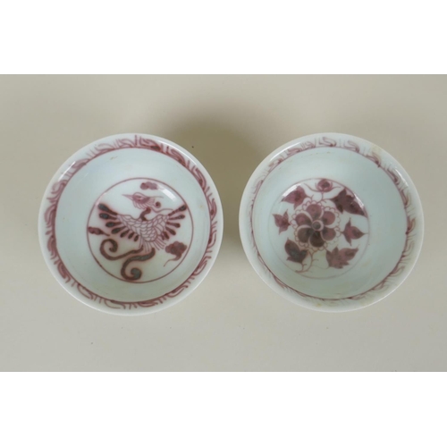 135 - A pair of Chinese Ming style red and white porcelain tea bowls decorated with flowers and phoenix, a... 