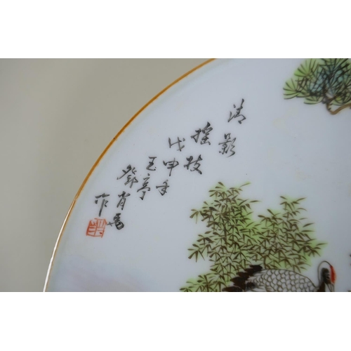 141 - A Chinese famille verte porcelain cabinet dish decorated with red crested cranes, character inscript... 