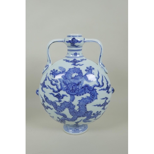 145 - A Chinese blue and white porcelain two handled moon flask with dragon decoration, Xuande 6 character... 