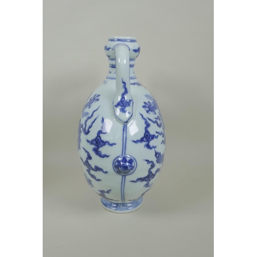 145 - A Chinese blue and white porcelain two handled moon flask with dragon decoration, Xuande 6 character... 