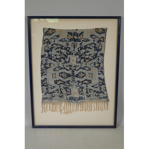 146 - An Indonesian Ikat textile wall hanging, framed, 56 x 78cm