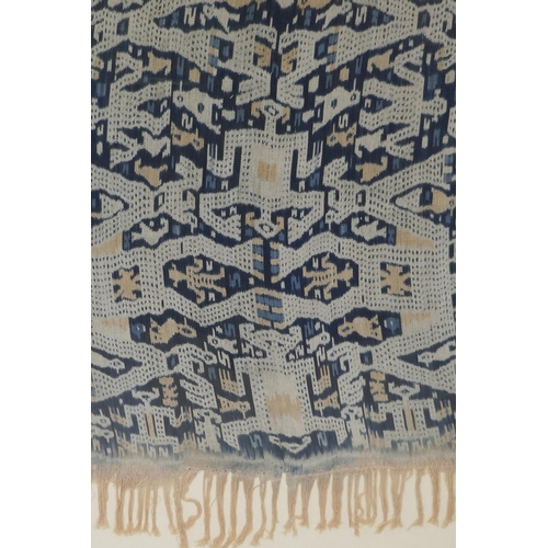 146 - An Indonesian Ikat textile wall hanging, framed, 56 x 78cm