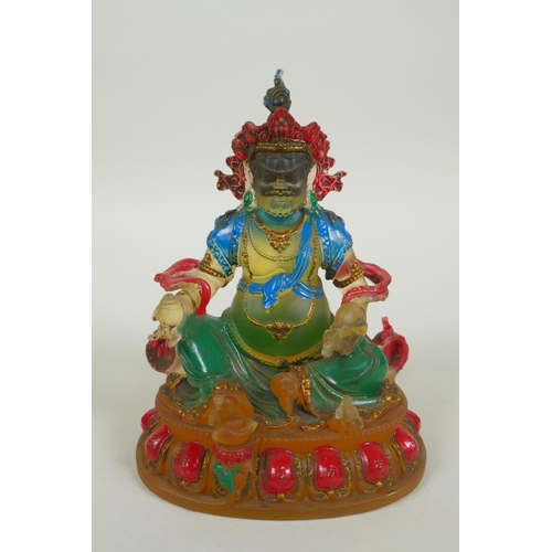 148 - A Sino Tibetan painted glass figure of Jambhala, 12cm high, 4 character mark to base