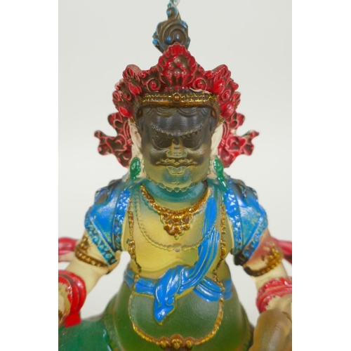 148 - A Sino Tibetan painted glass figure of Jambhala, 12cm high, 4 character mark to base