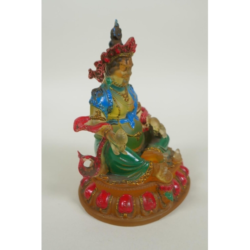 148 - A Sino Tibetan painted glass figure of Jambhala, 12cm high, 4 character mark to base