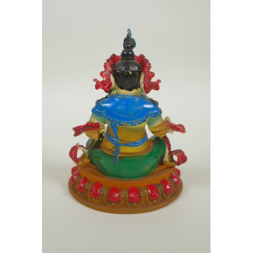 148 - A Sino Tibetan painted glass figure of Jambhala, 12cm high, 4 character mark to base