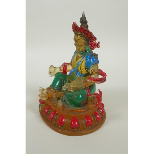 148 - A Sino Tibetan painted glass figure of Jambhala, 12cm high, 4 character mark to base