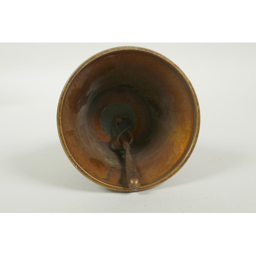 150 - A Tibetan ceremonial bronze bell with a vajra handle, 15cm high