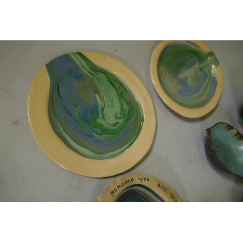 151 - A quantity of studio pottery, planters, plates and bowls, marked AF, plate with Oscar Wilde quote 32... 