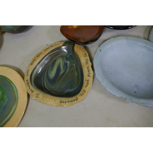 151 - A quantity of studio pottery, planters, plates and bowls, marked AF, plate with Oscar Wilde quote 32... 