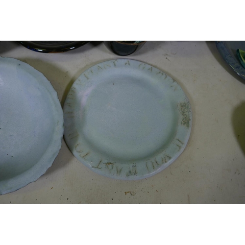 151 - A quantity of studio pottery, planters, plates and bowls, marked AF, plate with Oscar Wilde quote 32... 