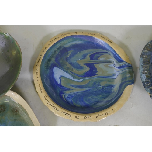 151 - A quantity of studio pottery, planters, plates and bowls, marked AF, plate with Oscar Wilde quote 32... 