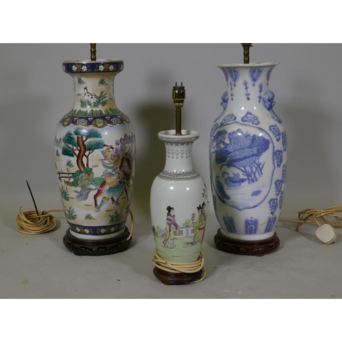 153 - A Chinese ceramic table lamp with blue and white decoration and wood base, 58cm high, and two others