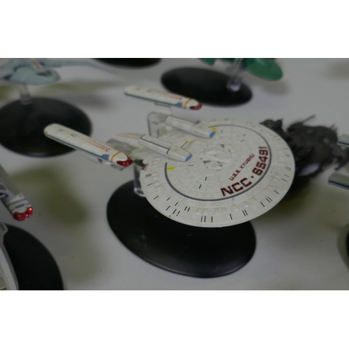 154 - A large collection of CBS studios Star Trek models, the majority with correct stands