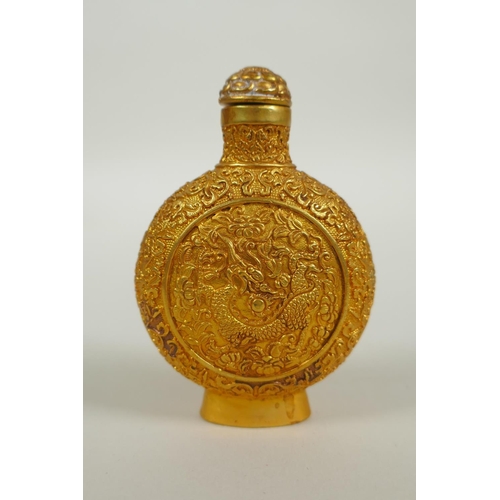 163 - A Chinese gilt bronze snuff bottle with raised dragon and floral decoration, 4 character mark to bas... 