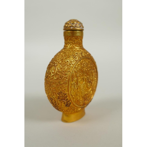 163 - A Chinese gilt bronze snuff bottle with raised dragon and floral decoration, 4 character mark to bas... 