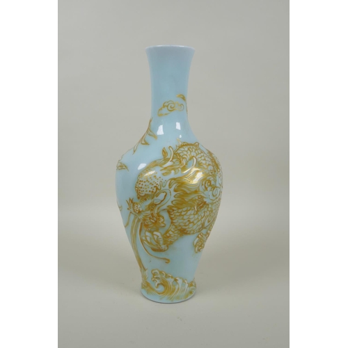 168 - A Chinese celadon ground porcelain vase with raised and gilt dragon decoration, Qianlong seal mark t... 