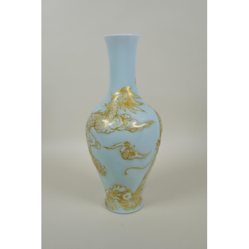 168 - A Chinese celadon ground porcelain vase with raised and gilt dragon decoration, Qianlong seal mark t... 