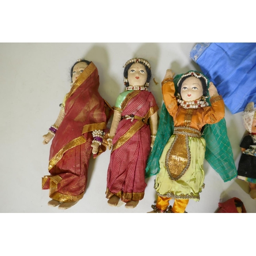 179 - A collection of antique dolls, Dutch, French, Scandinavian, including three Indian women in saris&nb... 