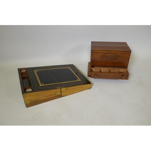 180 - A C19th walnut and brass bound campaign style writing slope with fitted interior, two glass inkwells... 