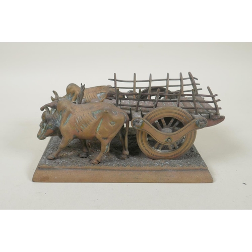 196 - A vintage Indian bronze figure of an ox cart, 17cm long