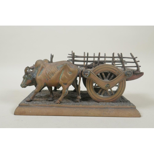 196 - A vintage Indian bronze figure of an ox cart, 17cm long