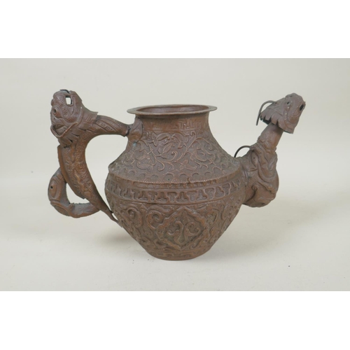 197 - A Tibetan coppered metal kettle with a dragon handle and spout, and repousse vine decoration, 17cm h... 