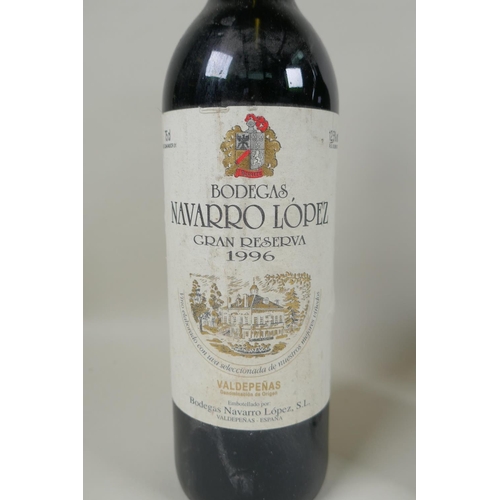 20 - Four bottles of red wine to include a bottle of Navarro Lopez Gran Reserva 1996, a bottle of Baron d... 