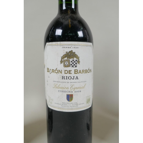 20 - Four bottles of red wine to include a bottle of Navarro Lopez Gran Reserva 1996, a bottle of Baron d... 