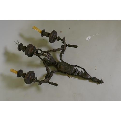 206 - A bronze three branch wall sconce, 50 x 70cm