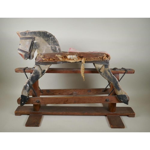 207 - An antique painted pine rocking horse, 82cm long, 56cm high