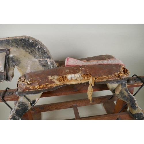 207 - An antique painted pine rocking horse, 82cm long, 56cm high